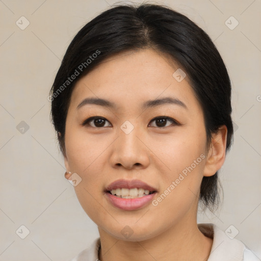 Joyful asian young-adult female with medium  black hair and brown eyes