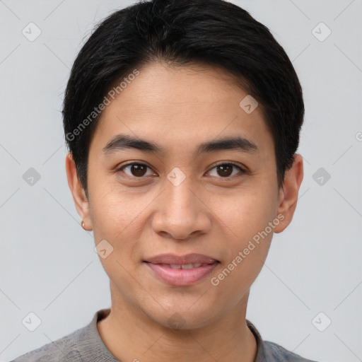 Joyful asian young-adult male with short  brown hair and brown eyes