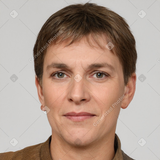 Joyful white adult male with short  brown hair and grey eyes