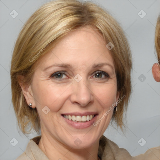 Joyful white adult female with medium  brown hair and blue eyes