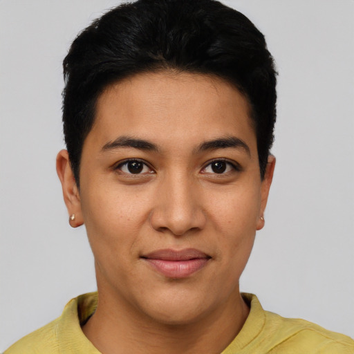 Joyful latino young-adult female with short  black hair and brown eyes