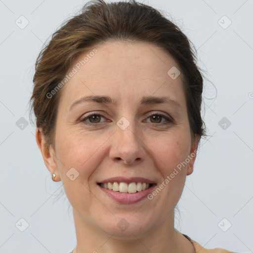 Joyful white adult female with short  brown hair and brown eyes