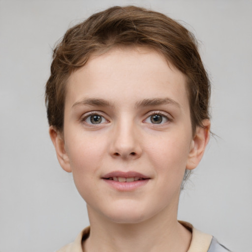 Joyful white child female with short  brown hair and grey eyes