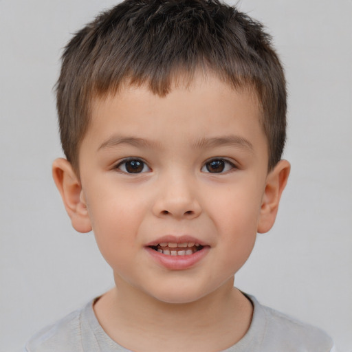 Joyful white child male with short  brown hair and brown eyes