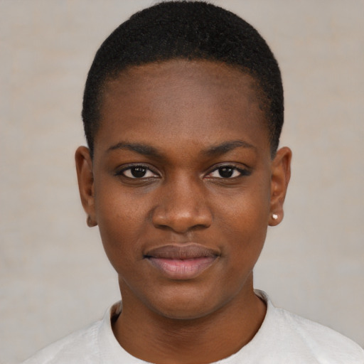 Joyful black young-adult female with short  black hair and brown eyes