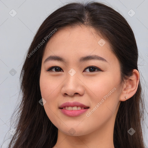 Joyful asian young-adult female with long  brown hair and brown eyes