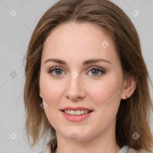 Joyful white young-adult female with medium  brown hair and green eyes