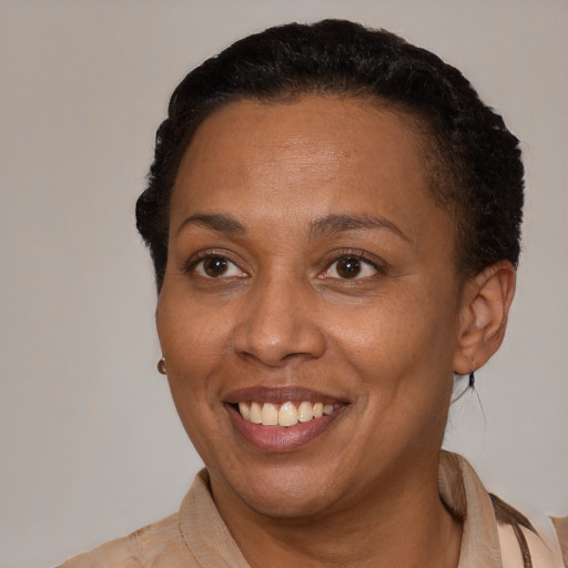 Joyful latino adult female with short  brown hair and brown eyes