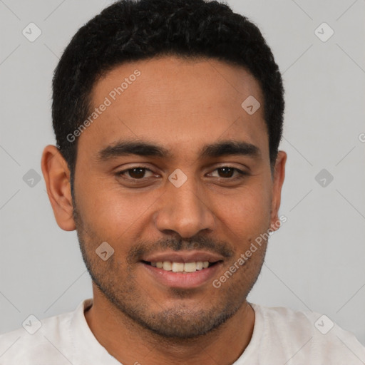 Joyful latino young-adult male with short  brown hair and brown eyes