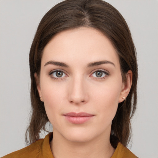 Neutral white young-adult female with medium  brown hair and brown eyes