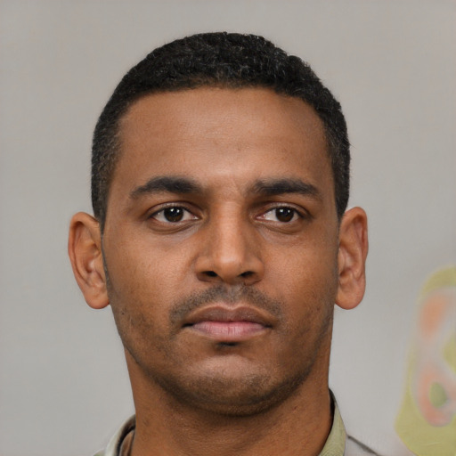 Neutral latino young-adult male with short  brown hair and brown eyes