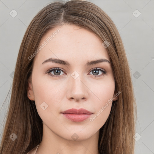 Neutral white young-adult female with long  brown hair and brown eyes