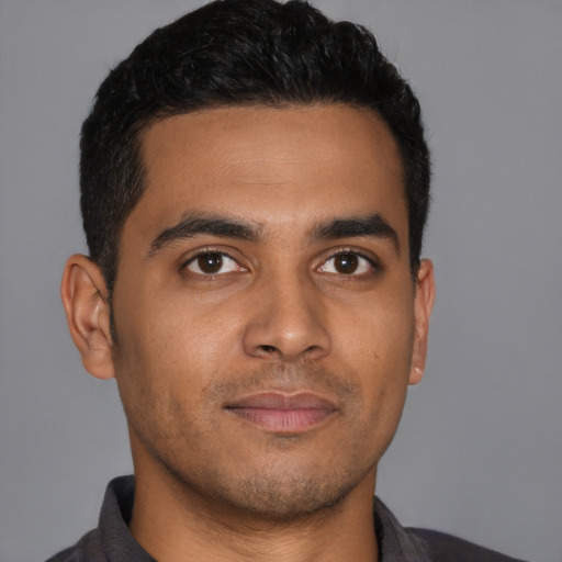 Neutral latino young-adult male with short  black hair and brown eyes