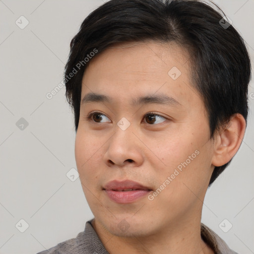 Neutral asian young-adult male with short  black hair and brown eyes