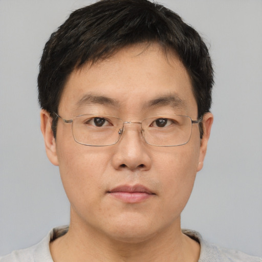 Neutral asian adult male with short  brown hair and brown eyes