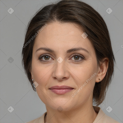 Joyful white adult female with medium  brown hair and brown eyes