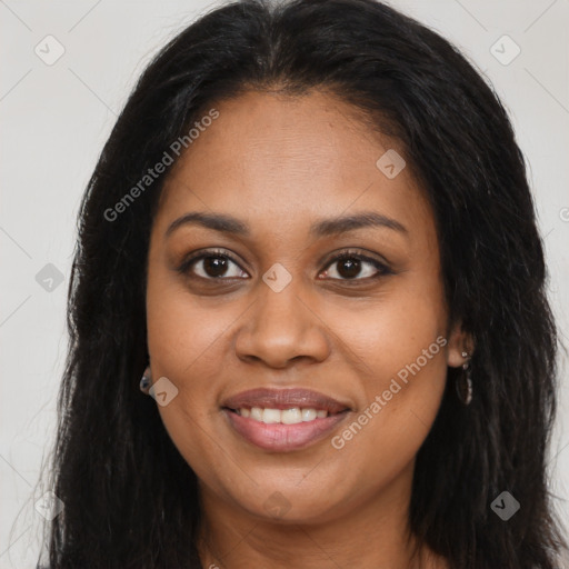 Joyful black young-adult female with long  brown hair and brown eyes