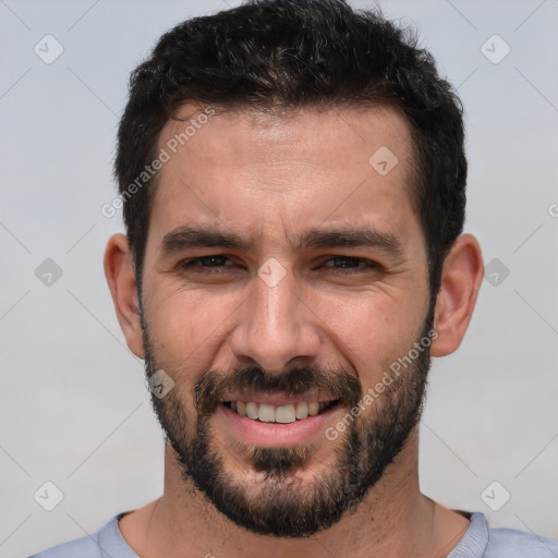 Joyful white adult male with short  brown hair and brown eyes