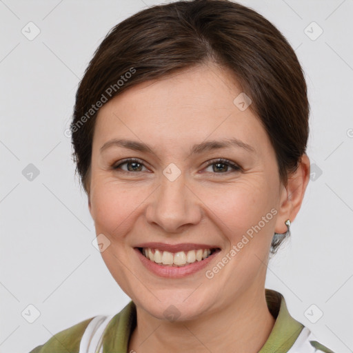 Joyful white young-adult female with medium  brown hair and brown eyes