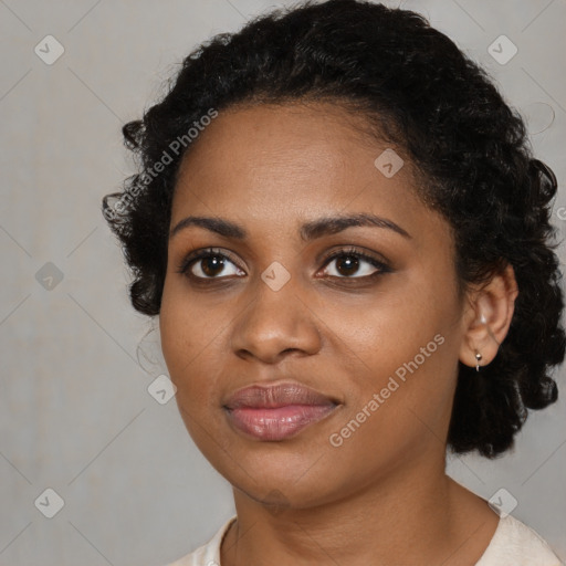 Joyful black young-adult female with medium  black hair and brown eyes