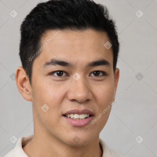 Joyful latino young-adult male with short  brown hair and brown eyes