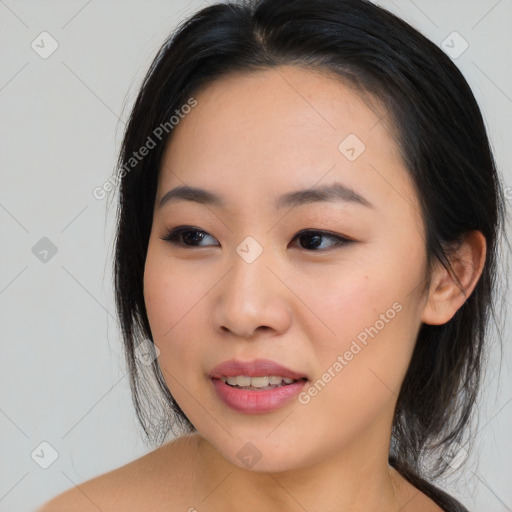 Joyful asian young-adult female with medium  brown hair and brown eyes