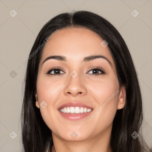 Joyful latino young-adult female with long  black hair and brown eyes