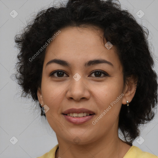 Joyful latino adult female with medium  brown hair and brown eyes