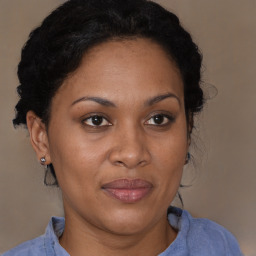 Joyful black adult female with short  brown hair and brown eyes