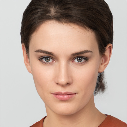 Neutral white young-adult female with short  brown hair and brown eyes