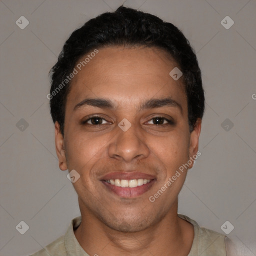 Joyful latino young-adult male with short  black hair and brown eyes