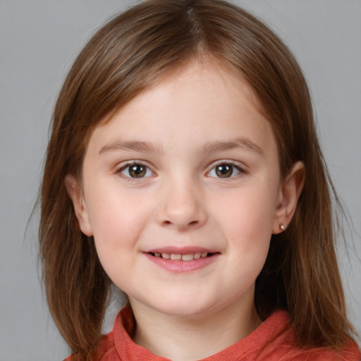 Joyful white child female with medium  brown hair and blue eyes