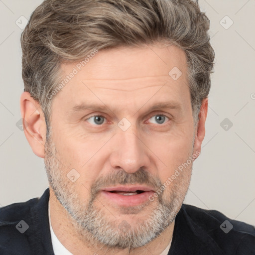 Joyful white adult male with short  brown hair and grey eyes