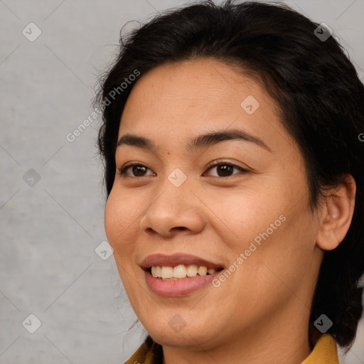 Joyful asian young-adult female with medium  brown hair and brown eyes