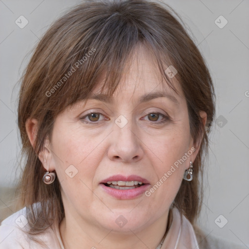 Joyful white adult female with medium  brown hair and grey eyes