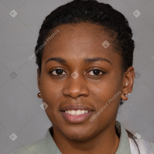 Joyful black young-adult female with short  black hair and brown eyes