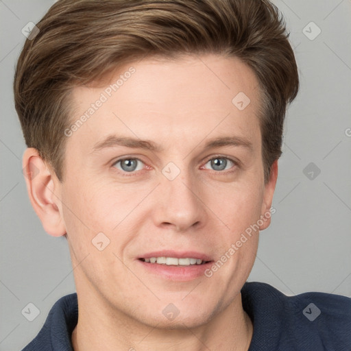 Joyful white adult male with short  brown hair and blue eyes