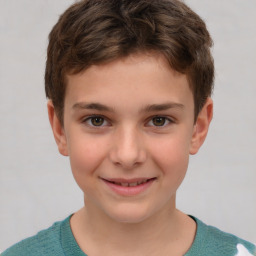 Joyful white child male with short  brown hair and brown eyes