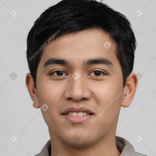 Joyful white young-adult male with short  black hair and brown eyes