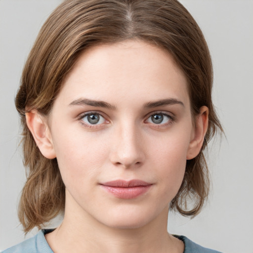 Neutral white young-adult female with medium  brown hair and grey eyes