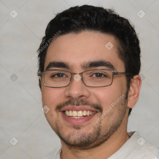 Joyful white young-adult male with short  black hair and brown eyes