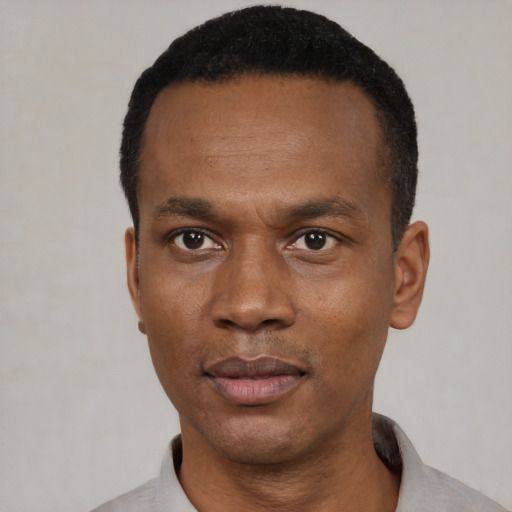 Neutral black young-adult male with short  black hair and brown eyes