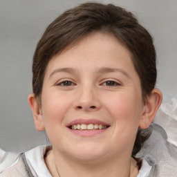 Joyful white child female with short  brown hair and brown eyes