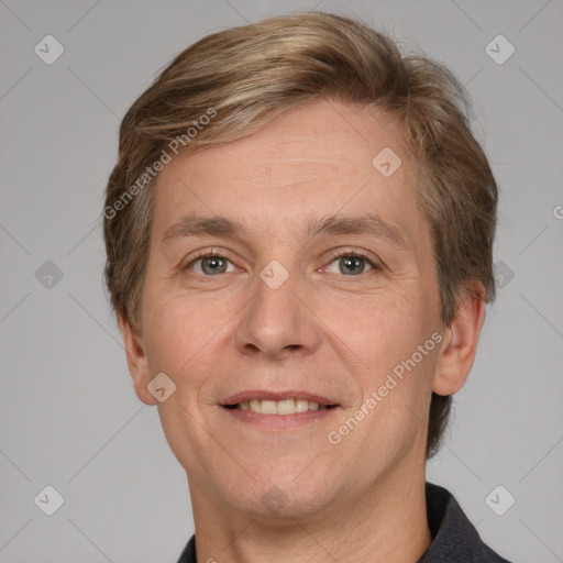 Joyful white adult male with short  brown hair and grey eyes