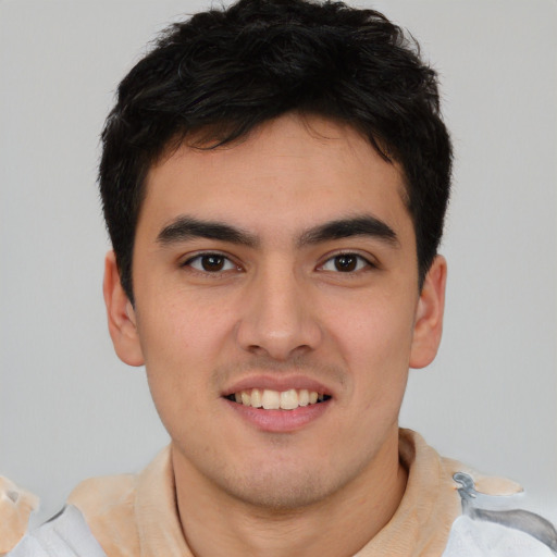 Joyful latino young-adult male with short  brown hair and brown eyes
