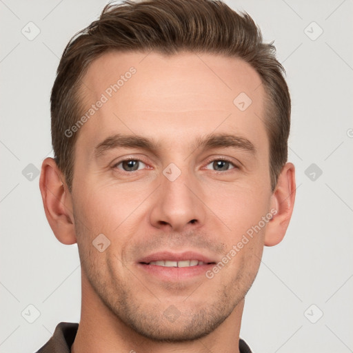 Joyful white young-adult male with short  brown hair and grey eyes