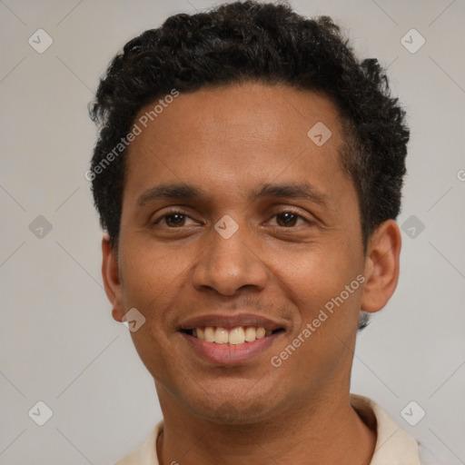 Joyful latino young-adult male with short  brown hair and brown eyes