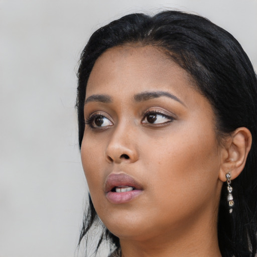 Neutral black young-adult female with long  black hair and brown eyes