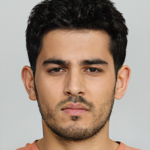 Neutral white young-adult male with short  black hair and brown eyes