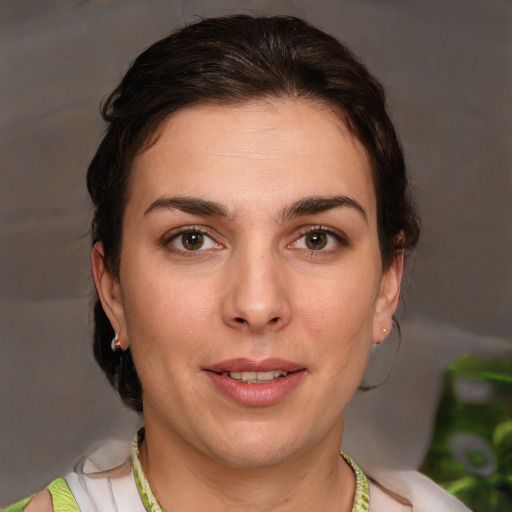 Joyful white young-adult female with short  brown hair and brown eyes